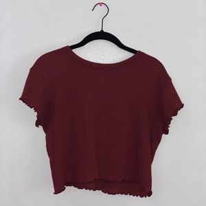 A maroon short sleeve top